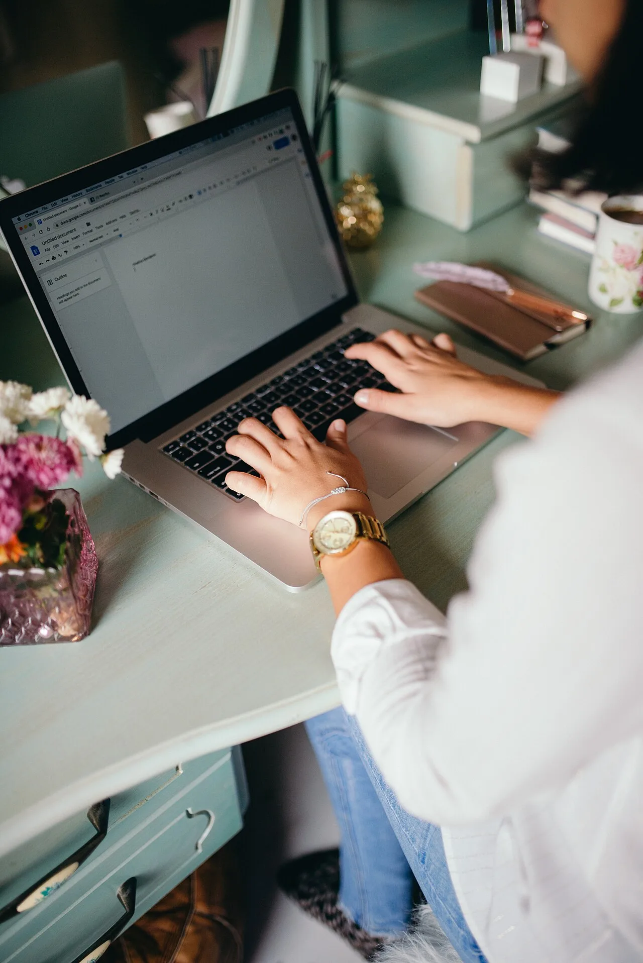 Adult woman using a laptop at home
