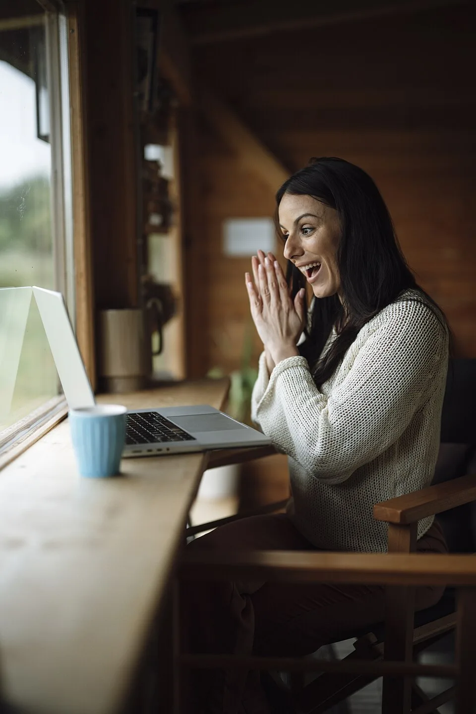 Adult woman enjoying a video conversation on a laptop