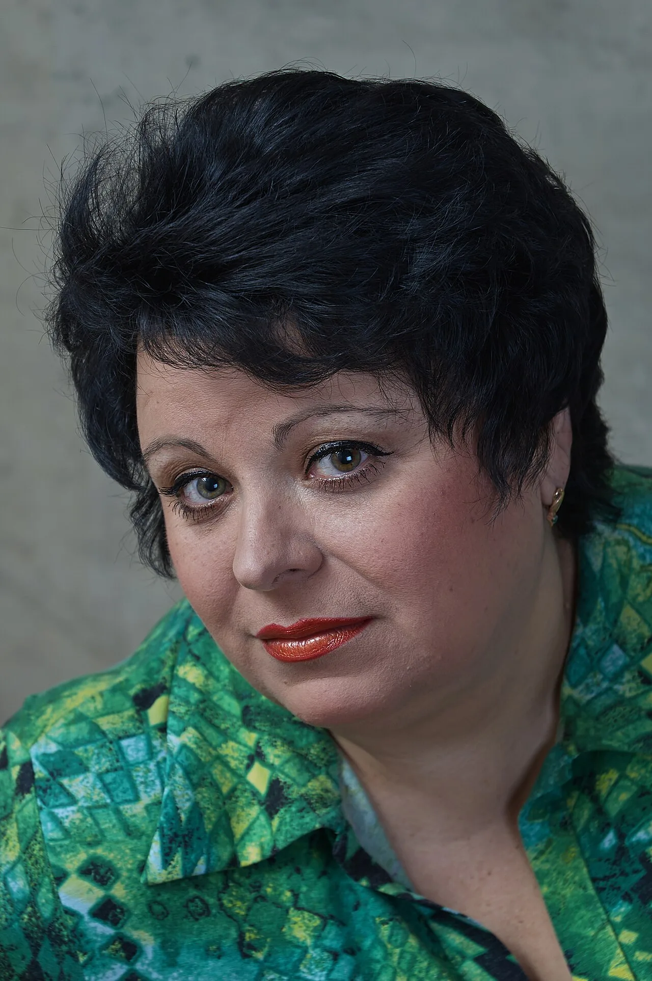 Portrait of an adult woman representing independent webcam models